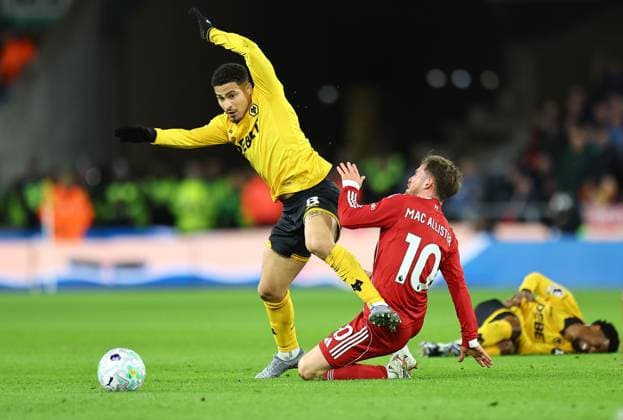 Joao Gomes of Wolverhampton Wanderers competes for the ball with Alexis Mac Allister of Liverpool Wolverhampton Wanderers v Liverpool, Premier League, Football, Molineux, Wolverhampton, UK - 03 Mar 2026Wolverhampton Molineux United Kingdom EDITORIAL USE ONLY No use with unauthorised audio, video, data, fixture lists, club league logos or live services. Online in-match use limited to 120 images, no video emulation. No use in betting, games or single club league player publications. Copyright: xMichaelxZemanek Shutterstockx 16719999ac