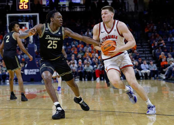 March 03, 2026: Wake Forest Demon Deacons Forward 25 Tre Von Spillers is called for a foul as he knocks the ball loose from Virginia Cavaliers Forward 28 Thijs De Ridder during a NCAA, College League, USA Men s Basketball game between the Wake Forest Demon Deacons and the University of Virginia Cavaliers at John Paul Jones Arena in Charlottesville, VA. CSM Charlottesville United States of America - ZUMAc04_ 20260303_zma_c04_001 Copyright: xJustinxCooperx
