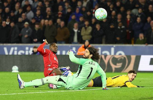 Rodrigo Gomes of Wolverhampton Wanderers scores the opening goal past Alisson Becker of Liverpool Wolverhampton Wanderers v Liverpool, Premier League, Football, Molineux, Wolverhampton, UK - 03 Mar 2026Wolverhampton Molineux United Kingdom EDITORIAL USE ONLY No use with unauthorised audio, video, data, fixture lists, club league logos or live services. Online in-match use limited to 120 images, no video emulation. No use in betting, games or single club league player publications. Copyright: xMichaelxZemanek Shutterstockx 16719999cv