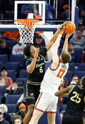 March 03, 2026: Wake Forest Demon Deacons Guard 6 Myles Colvin fouls Virginia Cavaliers Center 17 Johann Grunloh under the basket during a NCAA, College League, USA Men s Basketball game between the Wake Forest Demon Deacons and the University of Virginia Cavaliers at John Paul Jones Arena in Charlottesville, VA. CSM Charlottesville United States of America - ZUMAc04_ 20260303_zma_c04_022 Copyright: xJustinxCooperx