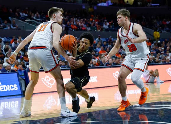 March 03, 2026: Wake Forest Demon Deacons Guard 10 Sebastian Akins trips over Virginia Cavaliers Center 17 Johann Grunlohs foot during a NCAA, College League, USA Men s Basketball game between the Wake Forest Demon Deacons and the University of Virginia Cavaliers at John Paul Jones Arena in Charlottesville, VA. CSM Charlottesville United States of America - ZUMAc04_ 20260303_zma_c04_026 Copyright: xJustinxCooperx