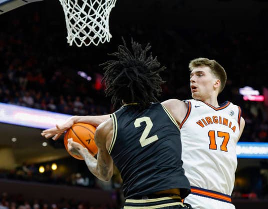March 03, 2026: Virginia Cavaliers Center 17 Johann Grunloh blocks the ball with his forearm against Wake Forest Demon Deacons Guard 2 Jake Harris during a NCAA, College League, USA Men s Basketball game between the Wake Forest Demon Deacons and the University of Virginia Cavaliers at John Paul Jones Arena in Charlottesville, VA. CSM Charlottesville United States of America - ZUMAc04_ 20260303_zma_c04_029 Copyright: xJustinxCooperx