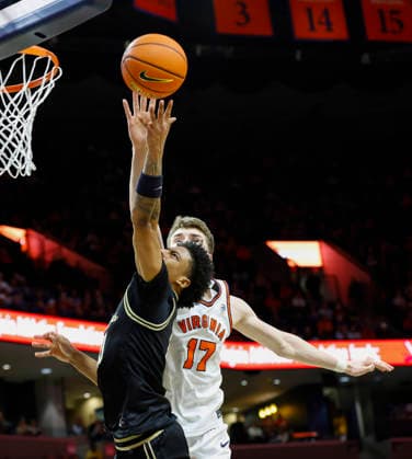 March 03, 2026: Virginia Cavaliers Center 17 Johann Grunloh knocks the ball away from Wake Forest Demon Deacons Guard 6 Myles Colvin uring a NCAA, College League, USA Men s Basketball game between the Wake Forest Demon Deacons and the University of Virginia Cavaliers at John Paul Jones Arena in Charlottesville, VA. CSM Charlottesville United States of America - ZUMAc04_ 20260303_zma_c04_030 Copyright: xJustinxCooperx