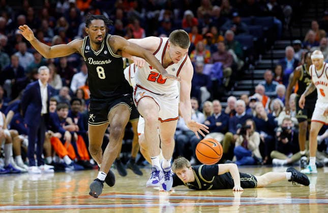 March 03, 2026: Virginia Cavaliers Forward 28 Thijs De Ridder tries to get away from Wake Forest Demon Deacons Guard 8 Mekhi Mason during a NCAA, College League, USA Men s Basketball game between the Wake Forest Demon Deacons and the University of Virginia Cavaliers at John Paul Jones Arena in Charlottesville, VA. CSM Charlottesville United States of America - ZUMAc04_ 20260303_zma_c04_044 Copyright: xJustinxCooperx