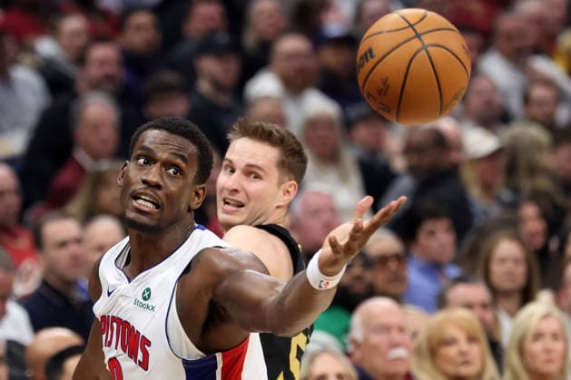Detroit Piston s Jalen Duren (0) reaches for a rebound next to Cleveland Cavalier s Sam Merrill (5) during the second quarter in Cleveland, Ohio Tuesday March 3, 2026. The Cavaliers defeated the Pistons 113-109.  CLE20260303107 AARONxJOSEFCZYK