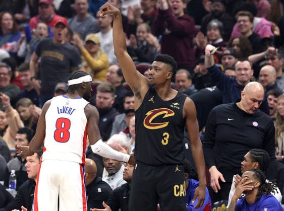 Cleveland Cavalier s Thomas Bryant (3) holds his release after hitting a three point shot over Detroit Piston s Caris LeVert (8) during the third quarter in Cleveland, Ohio Tuesday March 3, 2026. The Cavaliers defeated the Pistons 113-109.  CLE20260303117 AARONxJOSEFCZYK