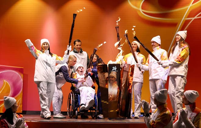 (260304) -- CORTINA D AMPEZZO, March 4, 2026 -- Torchbearers unify the flame during the Milan-Cortina 2026 Paralympic Winter games, Winterspiele,Spiele, Summer games Torch Relay and Flame Unifying Ceremony in Cortina D Ampezzo, Italy, March 3, 2026. ) (SP)ITALY-CORTINA D AMPEZZO-PARALYMPIC WINTER GAMES-FLAME UNIFYING CEREMONY WangxKaiyan 