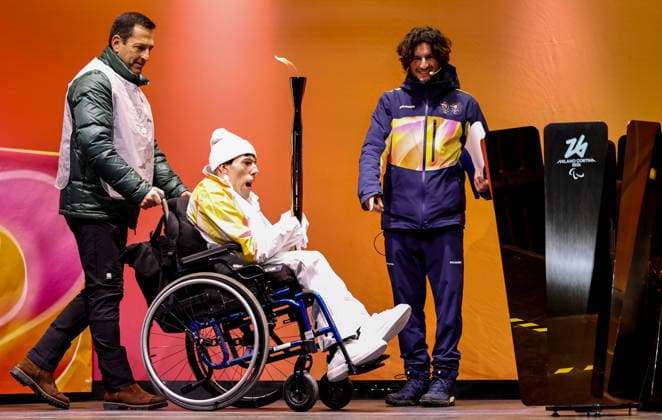 (260304) -- CORTINA D AMPEZZO, March 4, 2026 -- A torchbearer is seen during the Milan-Cortina 2026 Paralympic Winter games, Winterspiele,Spiele, Summer games Torch Relay and Flame Unifying Ceremony in Cortina D Ampezzo, Italy, March 3, 2026. ) (SP)ITALY-CORTINA D AMPEZZO-PARALYMPIC WINTER GAMES-FLAME UNIFYING CEREMONY WangxKaiyan 
