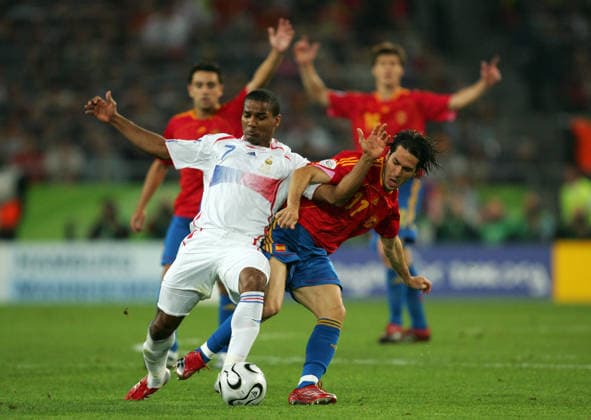 Jun 27, 2006; Hannover, Germany; FIFA World Cup, WM, Weltmeisterschaft, Fussball 2006 : Florent Malouda of France and Sanz Luis Garcia of Spain. Mandatory Credit: Photo by Matthew Ashton ZUMA Press. ( ) Copyright 2006 by Matthew Ashton Hannover Germany Copyright: xMatthewxAshtonx