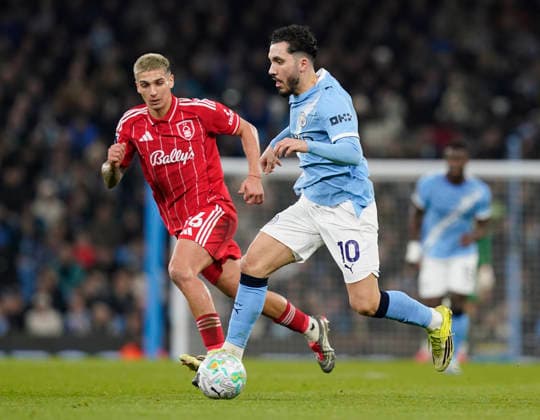 Manchester, England, 4th March 2026. Nicolas Dominguez of Nottingham Forest tracks Rayan Cherki of Manchester City during the Manchester City vs Nottingham Forest Premier League match at the Etihad Stadium, Manchester. Picture credit should read: Andrew Yates Sportimage EDITORIAL USE ONLY. No use with unauthorised audio, video, data, fixture lists, club league logos or live services. Online in-match use limited to 120 images, no video emulation. No use in betting, games or single club league player publications. SPI_032_AY_Manchester_City_Forest SPI-4576-0033