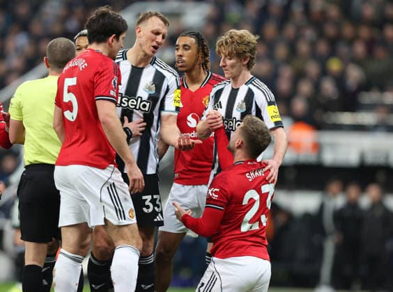 Newcastle Upon Tyne, England, 4th March 2026. Dan Burn of Newcastle United exchanges views with Luke Shaw of Manchester United, ManU after he went down under a challenge during the Newcastle United vs Manchester United Premier League match at St. James Park, Newcastle Upon Tyne. Picture credit should read: Nigel Roddis Sportimage EDITORIAL USE ONLY. No use with unauthorised audio, video, data, fixture lists, club league logos or live services. Online in-match use limited to 120 images, no video emulation. No use in betting, games or single club league player publications. SPI_027_NR_NEWC_MANC SPI-4578-0027