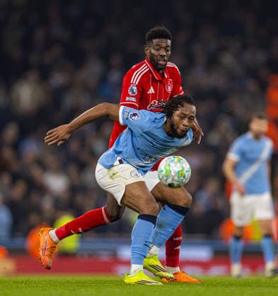 (260305) -- MANCHESTER, March 5, 2026 -- Nottingham Forest s Ibrahim Sangare (back) challenges Manchester City s Antoine Semenyo during the English Premier League match between Manchester City FC and Nottingham Forest FC in Manchester, Britain, on March 4, 2026. FOR EDITORIAL USE ONLY. NOT FOR SALE FOR MARKETING OR ADVERTISING CAMPAIGNS. NO USE WITH UNAUTHORIZED AUDIO, VIDEO, DATA, FIXTURE LISTS, CLUB LEAGUE LOGOS OR LIVE SERVICES. ONLINE IN-MATCH USE LIMITED TO 45 IMAGES, NO VIDEO EMULATION. NO USE IN BETTING, GAMES OR SINGLE CLUB LEAGUE PLAYER PUBLICATIONS. (SP)BRITAIN-MANCHESTER-FOOTBALL-PREMIER LEAGUE-MANCHESTER CITY VS NOTTINGHAM FOREST LixYing 