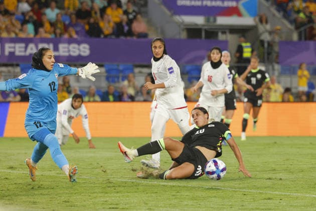 GOLD COAST, AUSTRALIA - MARCH 05 Sam Kerr (20 Australia) has an effort on goal blocked by Goalkeeper Maryam Yektaei (12 IR Iran) during the Womens Asian Cup match between Islamic Republic of Iran and Australia at the Gold Coast Stadium on March 05 2026 in Gold Coast, Australia Copyright: xMatthewxStarlingx xSPPx Sportspressphoto_SPR102267