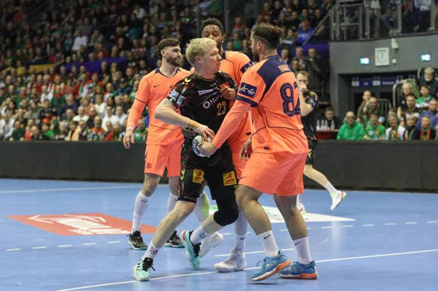 05 03 2026, xgox, Handball EHF Champions League SC Magdeburg FC Barcelona v l Timothey N guessan N guessan, Barcelona, 19 , Magnus Saugstrup Magdeburg, 23 , Luis Frade Barcelona, 82 duel, duel, fight, tackle Magdeburg