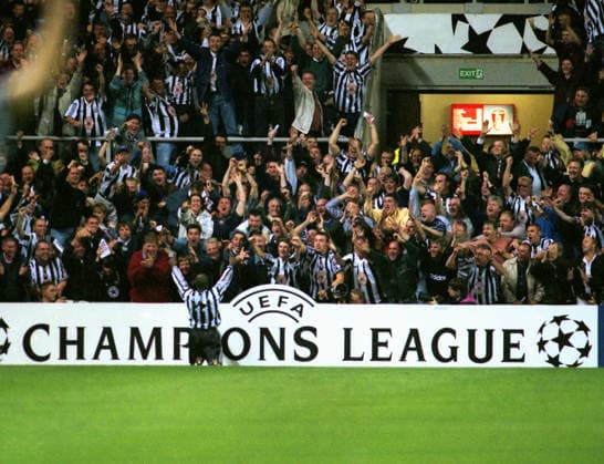 Football - 1997 1998 UEFA Champions League - Group C: Newcastle United 3 Barcelona 2 Faustino Asprilla - Newcastle United celebrates his goal in front of the Newcastle fans, at St James Park. COLORSPORT ANDREW COWIE 