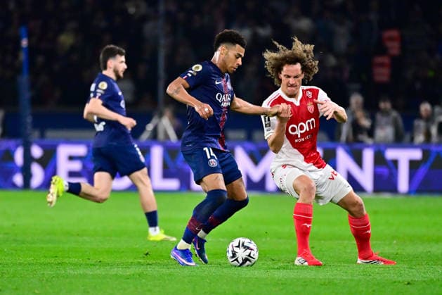 FOOTBALL : PSG vs Monaco - Ligue 1 - 06 03 2026 Desire Doue of Paris Saint Germain and Wout Faes of Monaco during the Ligue 1 match between Paris Saint Germain and AS Monaco at Parc des Princes on March 06, 2026 in Paris, France. ( Photo by Federico Pestellini PsnewZ ) - ParisFrance  Copyright: xFedericoxPestelinix