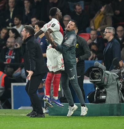 PSG vs AS Monaco: French Ligue 1 PARIS, FRANCE - MARCH 06: Folarin Balogun (C) of Monaco celebrates after scoring next to Sebastien Pocognoli, head coach of Monaco, Sebastien Pocognoli (L) during the French Ligue 1 (L1) soccer match between Paris Saint-Germain (PSG) and AS Monaco at Parc des Princes stadium in Paris, France on March 06, 2026. Mustafa Yalçin Anadolu Paris France. Editorial use only. Please get in touch for any other usage.  Copyright: x2026xAnadoluxMustafaxYalcÄ±nx