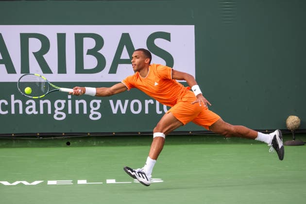 INDIAN WELLS, CA - MARCH 06: Felix Auger-Aliassime (CAN) stretches for a forehand during the BNP Paribas Open on March 6, 2026 at Indian Wells Tennis Garden in Indian Wells, CA. (Photo by George Walker Icon Sportswire) TENNIS: MAR 06 BNP Paribas Open EDITORIAL USE ONLY Icon260306057