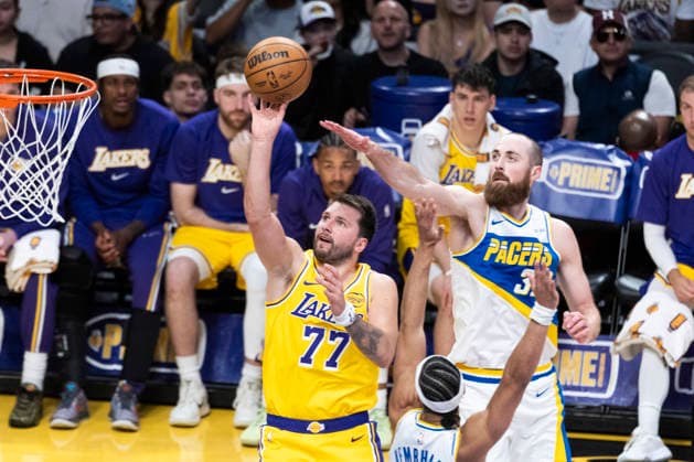 March 6, 2026, Los Angeles, California, USA: Los Angeles LakersÃ¢â‚¬â ¢ Luka DonÄÂiÄ¡ (77) shoots under pressure from Indiana PacersÃ¢â‚¬â ¢ Jay Huff (32) during an NBA, Basketball Herren, USA basketball game at Crypto.com Arena on Friday, March 6, 2026 in Los Angeles. NBA 2026: Pacers Vs Lakers  - ZUMAc68_ 20260306_zaf_c68_036 Copyright: xRingoxChiux
