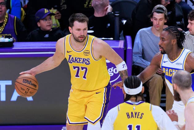 March 6, 2026, Los Angeles, California, USA: Luka Doncic 77 of the Los Angeles Lakers receives the ball as Aaron Nesmith 23 of the Indiana Pacers defends during their regular season NBA, Basketball Herren, USA game on Friday March 6, 2026 at Crypto.com Arena in Los Angeles, California. ARIANA RUIZ PI Lakers Vs. Pacers  - ZUMAp124 20260306_zaa_p124_026 Copyright: xArianaxRuizx