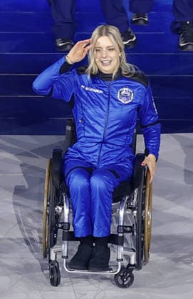 Milan Cortina Paralympics: Opening ceremony Aerospace engineer Michaela Benthaus waves to the crowd as she appears in the opening ceremony of the Milan Cortina Paralympics at the Verona Arena, a Roman amphitheater in Verona, Italy, on March 6, 2026.  A14AA0005355673P