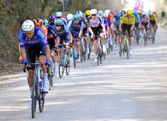 The pack of riders pictured in action during the men elite Strade Bianche one day cycling race, 203km from and to Siena, Italy on Saturday 07 March 2026. DIRKxWAEM  x166728976x
