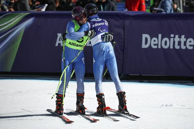 ITALY, VENETO - MARCH 7, 2026: Giacomo Bertagnolli (R) of Italy and his guide Andrea Ravelli compete in the men s downhill skiing event for visually impaired athletes during the 2026 Winter Paralympic Games on the Olympia delle Tofane of the Tofane Alpine Skiing Centre in Cortina d Ampezzo, Province of Belluno. Mikhail Tereshchenko TASS  89692825