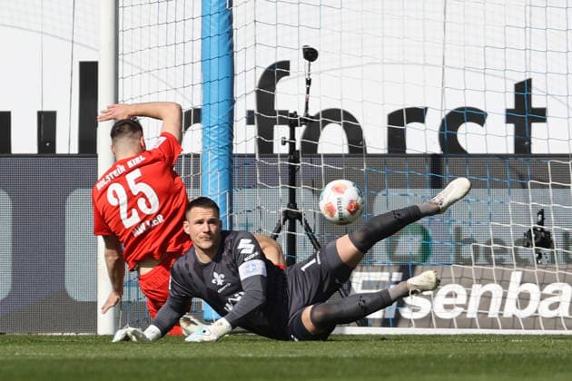 07 03 2026, xtvx, Fussball 2 Bundesliga, SV Darmstadt 98 Holstein Kiel v l Torschuss, has a shot on goal Marcus Mueller Holstein Kiel goalkeeper Marcel Schuhen SV Darmstadt 98 DFL DFB REGULATIONS PROHIBIT ANY USE OF PHOTOGRAPHS as IMAGE SEQUENCES and or QUASI VIDEO Darmstadt