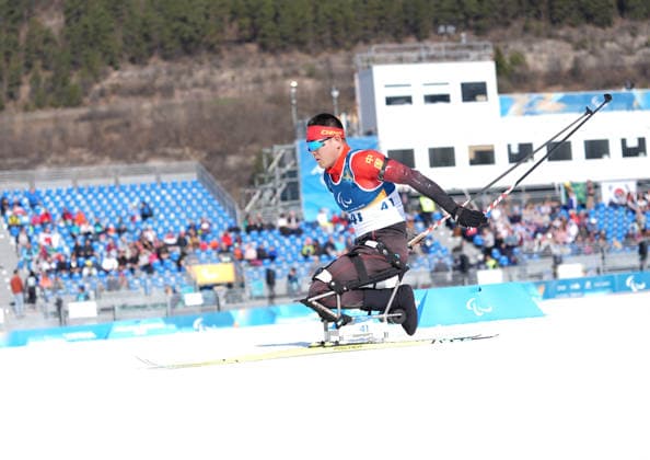 (260307) -- TESERO, March 7, 2026 -- Wang Tao of China competes during the men s sprint sitting final of para biathon at the Milan-Cortina 2026 Paralympic Winter games, Winterspiele,Spiele, Summer games in Tesero, Italy, March 7, 2026. ) (SP)ITALY-TESERO-PARALYMPIC WINTER GAMES-PARA BIATHLON-MEN S SPRINT SITTING HouxZhaokang 