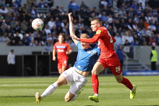 07 03 2026, xtvx, Fußball 2 Bundesliga, SV Darmstadt 98 Holstein Kiel v l Zweikampf, Duell, duel, tackle, compete Isac Lidberg SV Darmstadt 98 David Zec Holstein Kiel DFL DFB REGULATIONS PROHIBIT ANY USE OF PHOTOGRAPHS as IMAGE SEQUENCES and or QUASI VIDEO Darmstadt