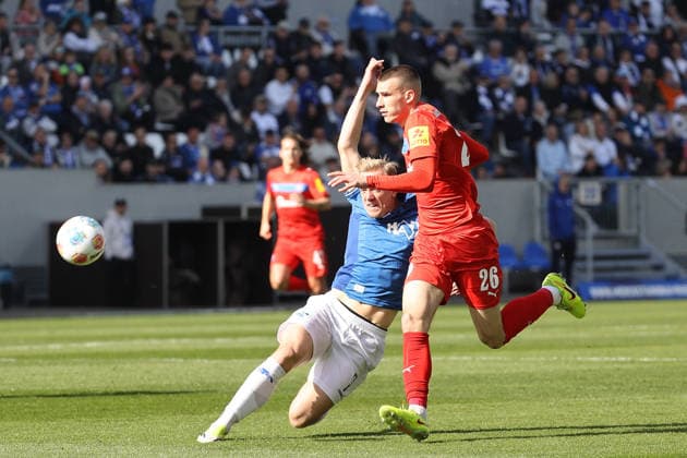 07 03 2026, xtvx, Fußball 2 Bundesliga, SV Darmstadt 98 Holstein Kiel v l Zweikampf, Duell, duel, tackle, compete Isac Lidberg SV Darmstadt 98 David Zec Holstein Kiel DFL DFB REGULATIONS PROHIBIT ANY USE OF PHOTOGRAPHS as IMAGE SEQUENCES and or QUASI VIDEO Darmstadt