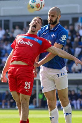 07 03 2026, xhettx, Soccer 2 Bundesliga, SV Darmstadt 98 Holstein Kiel v l Header duel Marcus Müller KSV Holstein Kiel, 25 and Aleksandar Vukotic SV Darmstadt 98, 20 DFL DFB REGULATIONS PROHIBIT ANY USE OF PHOTOGRAPHS as IMAGE SEQUENCES and or QUASI VIDEO