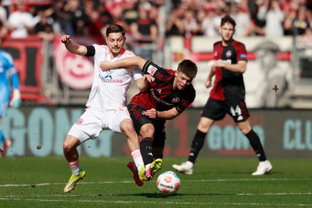 f l n r duel between Florent Muslija Fortuna Düsseldorf and Finn Becker 1 FC Nürnberg Football 2 Bundesliga, 1 FC Nürnberg - Fortuna Düsseldorf at the Max Morlock Stadion, Nuremberg, Germany, on March 7, 2026 in action during the 2 Bundesliga match between 1 FC Nürnberg and Fortuna Düsseldorf at the Max Morlock Stadion, Nuremberg, Germany, on March 7, 2026 DFL REGULATIONS PROHIBIT ANY USE OF PHOTOGRAPHS AS IMAGE SEQUENCES AND OR QUASI VIDEO Copyright: HMBxMedia xHeikoxBecker