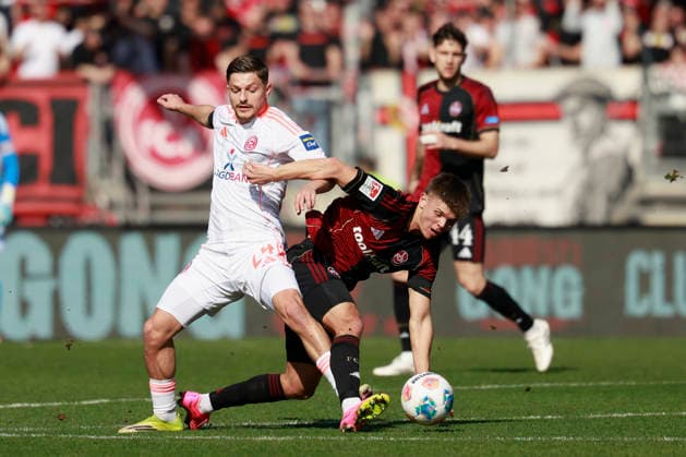 f l n r duel between Florent Muslija Fortuna Düsseldorf and Finn Becker 1 FC Nürnberg Football 2 Bundesliga, 1 FC Nürnberg - Fortuna Düsseldorf at the Max Morlock Stadion, Nuremberg, Germany, on March 7, 2026 in action during the 2 Bundesliga match between 1 FC Nürnberg and Fortuna Düsseldorf at the Max Morlock Stadion, Nuremberg, Germany, on March 7, 2026 DFL REGULATIONS PROHIBIT ANY USE OF PHOTOGRAPHS AS IMAGE SEQUENCES AND OR QUASI VIDEO Copyright: HMBxMedia xHeikoxBecker