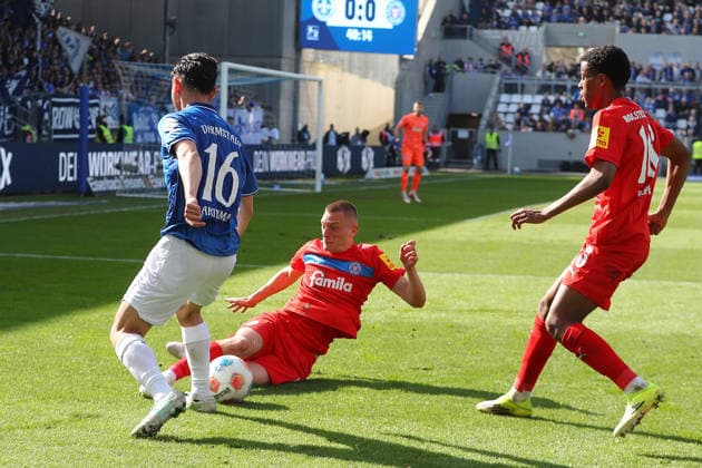 07 03 2026, xtvx, Fußball 2 Bundesliga, SV Darmstadt 98 Holstein Kiel v l Zweikampf, Duell, duel, tackle, compete Hiroki Akiyama SV Darmstadt 98 Ivan Nekic Holstein Kiel DFL DFB REGULATIONS PROHIBIT ANY USE OF PHOTOGRAPHS as IMAGE SEQUENCES and or QUASI VIDEO Darmstadt