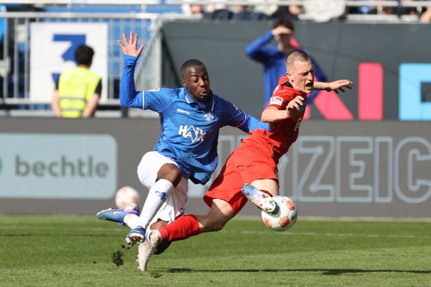 07 03 2026, xtvx, Fußball 2 Bundesliga, SV Darmstadt 98 Holstein Kiel v l Zweikampf, Duell, duel, tackle, compete Merveille Papela SV Darmstadt 98 Ivan Nekic Holstein Kiel DFL DFB REGULATIONS PROHIBIT ANY USE OF PHOTOGRAPHS as IMAGE SEQUENCES and or QUASI VIDEO Darmstadt