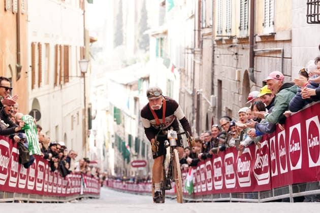 cyclist in historical costume during the Strade Bianche Woman Elite (White Roads) a 133 km one day race from and to Siena (Tuscany), Italy - Saturday March 7, 2025 - - cycling  Copyright: xMassimoxPaolone LaPressex