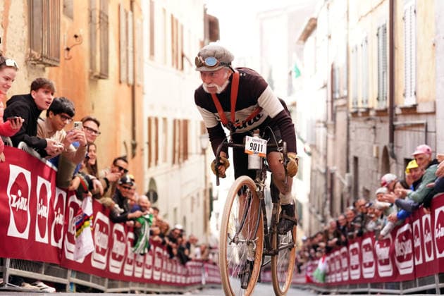 cyclist in historical costume during the Strade Bianche Woman Elite (White Roads) a 133 km one day race from and to Siena (Tuscany), Italy - Saturday March 7, 2025 - - cycling  Copyright: xMassimoxPaolone LaPressex