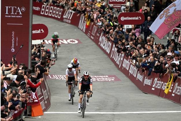 Swiss Elise Chabbey of FDJ Suez celebrates as she crosses the finish line to win the women elite Strade Bianche one day cycling race, 133km from and to Siena, Italy, on Saturday 07 March 2026. ELIASxROM  x166737759x