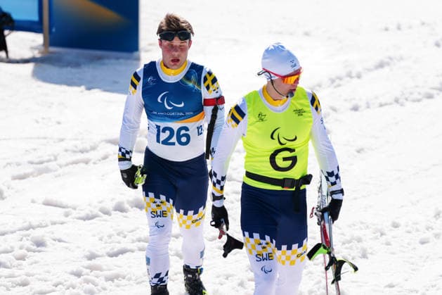 260307 Zebastian Modin of Sweden with guide Emil Talsi after competing in men s sprint vision impaired biathlon on March 7, 2026 in Val di Fiemme. Photo: Oscar Olsson Swedish Parasport Federation BILDBYRAN kod XY XY0100 skidskytte biathlon skiskyting 2026 paralympics day 1 para biathlon mens sprint sitting bbeng paralympic games paralympics paralympiska spel paralympiske leker vinter-paralympics winter paralympics milano cortina 2026 milano cortina 2026 winter paralympic games paraskidskytte *** 260307 Zebastian Modin of Sweden with guide Emil Talsi after competing in men s sprint vision impaired biathlon on March 7, 2026 in Val di Fiemme Photo Oscar Olsson Swedish Parasport Federation BILDBYRAN code XY XY0100 biathlon biathlon biathlon 2026 paralympics day 1 para biathlon mens sprint sitting bbeng paralympic games paralympiska spel paralympiske leker vinter paralympics winter paralympics milano cortina 2026 milano cortina 2026 winter paralympic games paraskidskytte  Copyright: OscarxOlsson BB260307ZO022