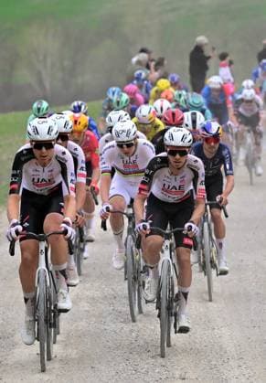 Slovenian Tadej Pogacar of UAE Team Emirates - XRG (C) pictured in action during the men elite Strade Bianche one day cycling race, 203km from and to Siena, Italy on Saturday 07 March 2026. DIRKxWAEM  x166739855x