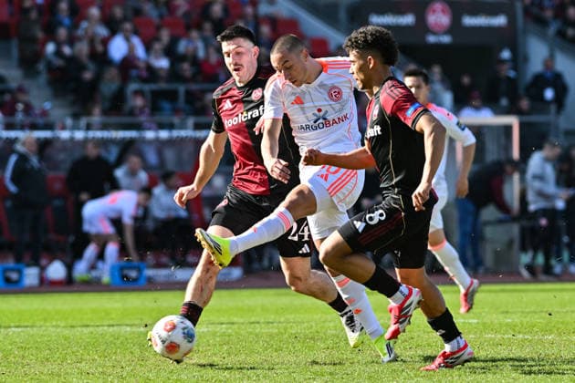 2 Bundesliga 1 FC Nuremberg Fortuna Düsseldorf 07 03 2026 NUREMBERG, GERMANY 07 MARCH in the duel Ondrej KARAFIAT 1 FC Nuremberg 44 and Marin LJUBICIC Fortuna Düsseldorf 20 and Henri KOUDOSSOU 1 FC Nuremberg 8 during the match between 1 FC Nuremberg and Fortuna Düsseldorf on matchday 25 of Bundesliga 2 at Max Morlock Stadion DFL REGULATIONS PROHIBIT ANY USE OF PHOTOGRAPHS AS IMAGE SEQUENCES AND OR QUASI VIDEO Copyright: xBEAUTIFULxSPORTS Goldbergx
