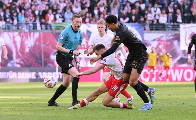 Referee Eleni Antoniou, Christoph Baumgartner on the ball, Noahkai Banks duel Match scene Action Sport Soccer Football DFL Bundesliga Men 25 Matchday Season 2025 2026 07 03 2026 RasenBallsport RB Leipzig RBL vs FC Augsburg FCA at RedBull Arena DFL regulations prohibit any use of photographs as image sequences and or quasi video