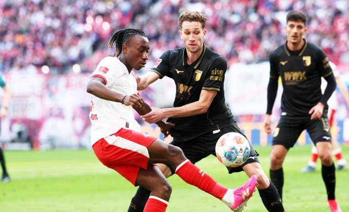 RB Leipzig Augsburg Bundesliga Leipzig, 07 03 2026, Red Bull Arena, Soccer, 1 Bundesliga, 25 Matchday , RB Leipzig vs FC Augsburg , Pictured from left Yan Diomande 49, RB Leipzig , Arthur Chaves 34, Augsburg , For editorial use only Only editorial use , DFL DFB regulations prohibit any use of photographs as image sequences and or quasi video ,