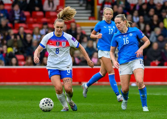 Georgia Stanway (England) attacking with the ball with Hildur Antonsd—ttir (Iceland) defending during the Womens European World Cup Qualifier 2027 match between England Women and Iceland Women at the City Ground, Nottingham, England on 7 March 2026. Copyright: xMarkxDunnx 44650012