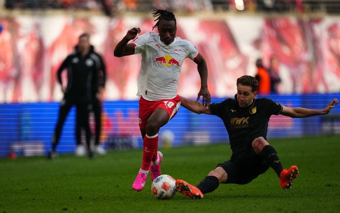 Yan Diomande RB Leipzig and Noahkai Banks FC Augsburg battle for the ball during the Bundesliga 1 match between RB¯Leipzig¯and¯FC¯Augsburg, Red¯Bull¯Arena, Leipzig, Germany on 07 March 2026 Photo by Thor Wegner DeFodi Images Yan Diomande RB Leipzig and Noahkai Banks FC Augsburg battle for the ball during RB¯Leipzig¯and¯FC¯Augsburg at Red¯Bull¯Arena, Leipzig, Germany on March 7, 2026 Thor Wegner DeFodi Images Photo by DeFodi Images