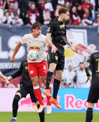RB Leipzig Augsburg Bundesliga Leipzig, 07 03 2026, Red Bull Arena, Soccer, 1 Bundesliga, 25 Matchday , RB Leipzig vs FC Augsburg , Pictured from left Willi Orban 4, RB Leipzig , Arthur Chaves 34, Augsburg , For editorial use only Only editorial use , DFL DFB regulations prohibit any use of photographs as image sequences and or quasi video ,