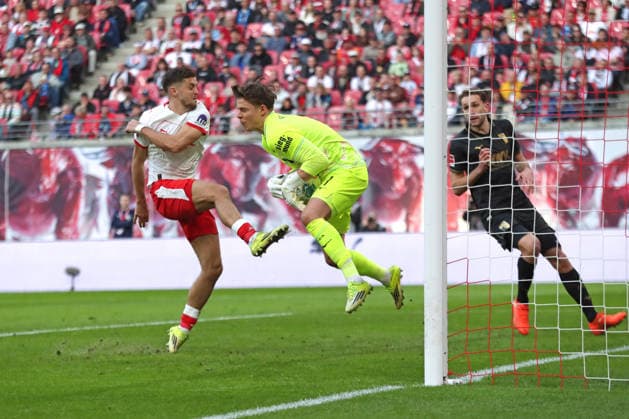 1 Soccer Bundesliga RB Leipzig FC Augsburg 07 03 2026 Christoph Baumgartner 14, RB Leipzig jumps foot first into goalkeeper Finn Dahmen 1, FC Augsburg inside LEIPZIG, GERMANY MARCH 7 Bundesliga match RB Leipzig FC Augsburg at Red Bull Arena on matchday 25 of Bundesliga 1 on March 7, 2026 in Leipzig, Germany DFL REGULATIONS PROHIBIT ANY USE OF PHOTOGRAPHS AS IMAGE SEQUENCES AND OR QUASI VIDEO Copyright: xBEAUTIFULxSPORTS JanxKaeferx