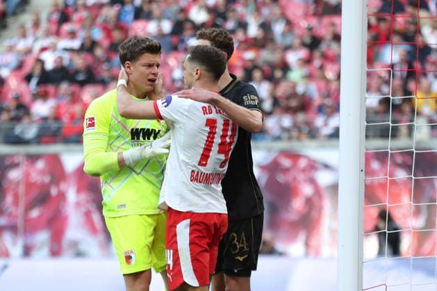 1 Soccer Bundesliga RB Leipzig FC Augsburg 07 03 2026 Christoph Baumgartner 14, RB Leipzig apologizes to goalkeeper Finn Dahmen 1, FC Augsburg for his painful action LEIPZIG, GERMANY MARCH 7 Bundesliga match RB Leipzig FC Augsburg at Red Bull Arena on matchday 25 of Bundesliga 1 on March 7, 2026 in Leipzig, Germany DFL REGULATIONS PROHIBIT ANY USE OF PHOTOGRAPHS AS IMAGE SEQUENCES AND OR QUASI VIDEO Copyright: xBEAUTIFULxSPORTS JanxKaeferx