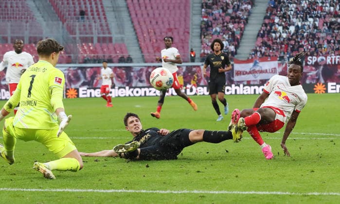 Yan Diomande scores the goal to equalize 1 1 against goalkeeper Finn Dahmen duel Match scene Action Sport Soccer Football DFL Bundesliga Men 25 Matchday Season 2025 2026 07 03 2026 RasenBallsport RB Leipzig RBL vs FC Augsburg FCA at RedBull Arena DFL regulations prohibit any use of photographs as image sequences and or quasi video